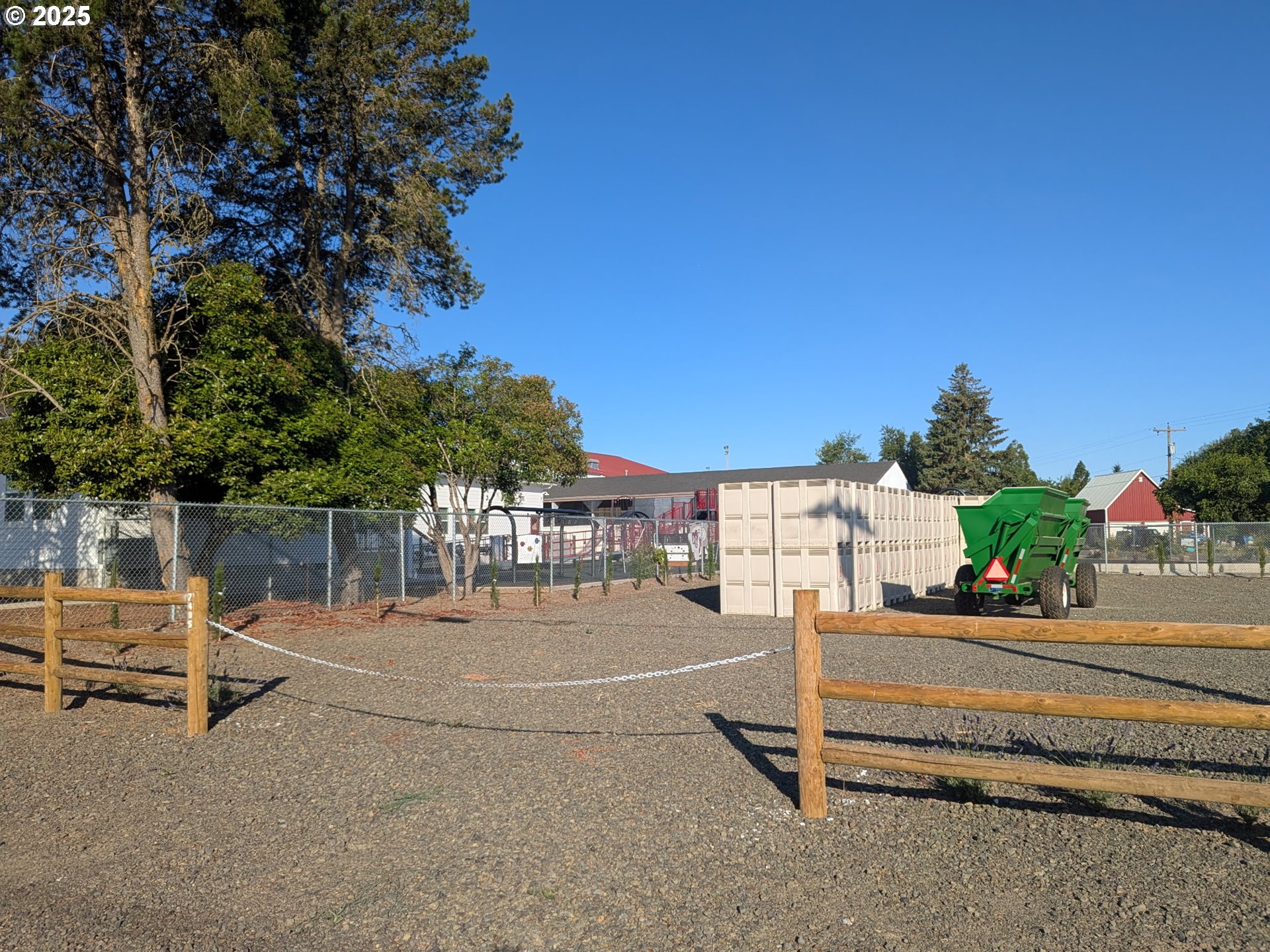 7495 Perrydale Road Amity, OR 97101 - Photo 5 of 21 a row of palm trees and a yard of the house