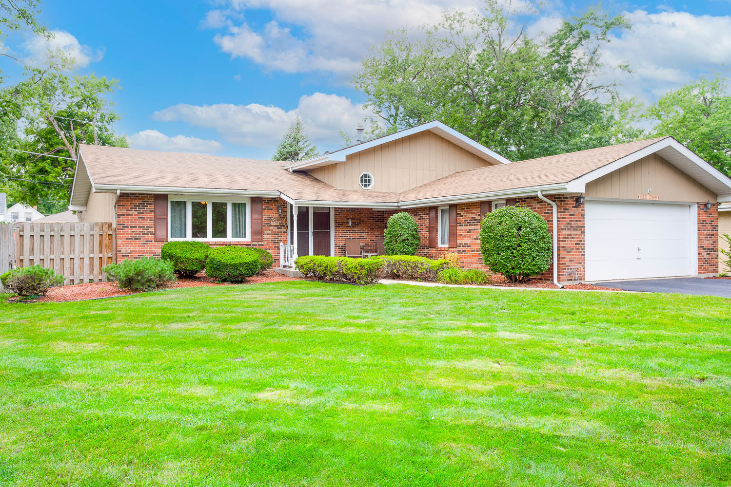 17936 Dekker Avenue Lansing, IL 60438 - Photo 1 of 35 a view of a house with big yard and large trees