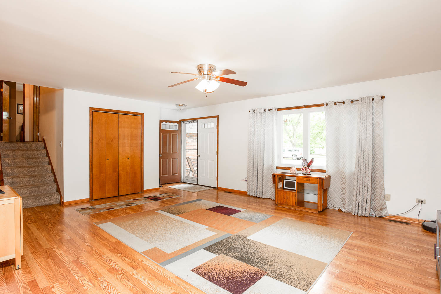 17936 Dekker Avenue Lansing, IL 60438 - Photo 12 of 35 a view of a livingroom with furniture window and wooden floor