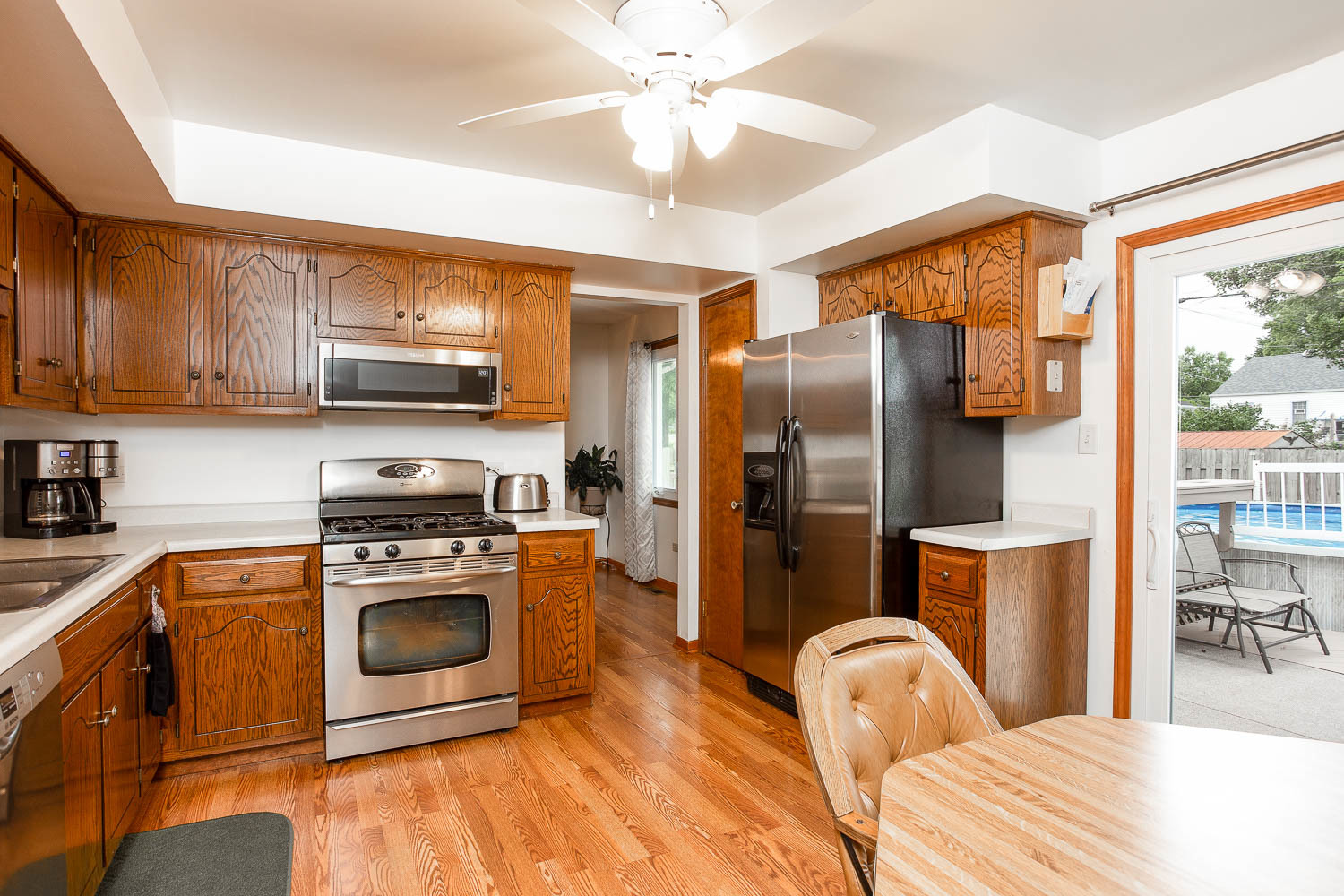17936 Dekker Avenue Lansing, IL 60438 - Photo 17 of 35 a kitchen with stainless steel appliances granite countertop a refrigerator a stove top oven a sink and dishwasher