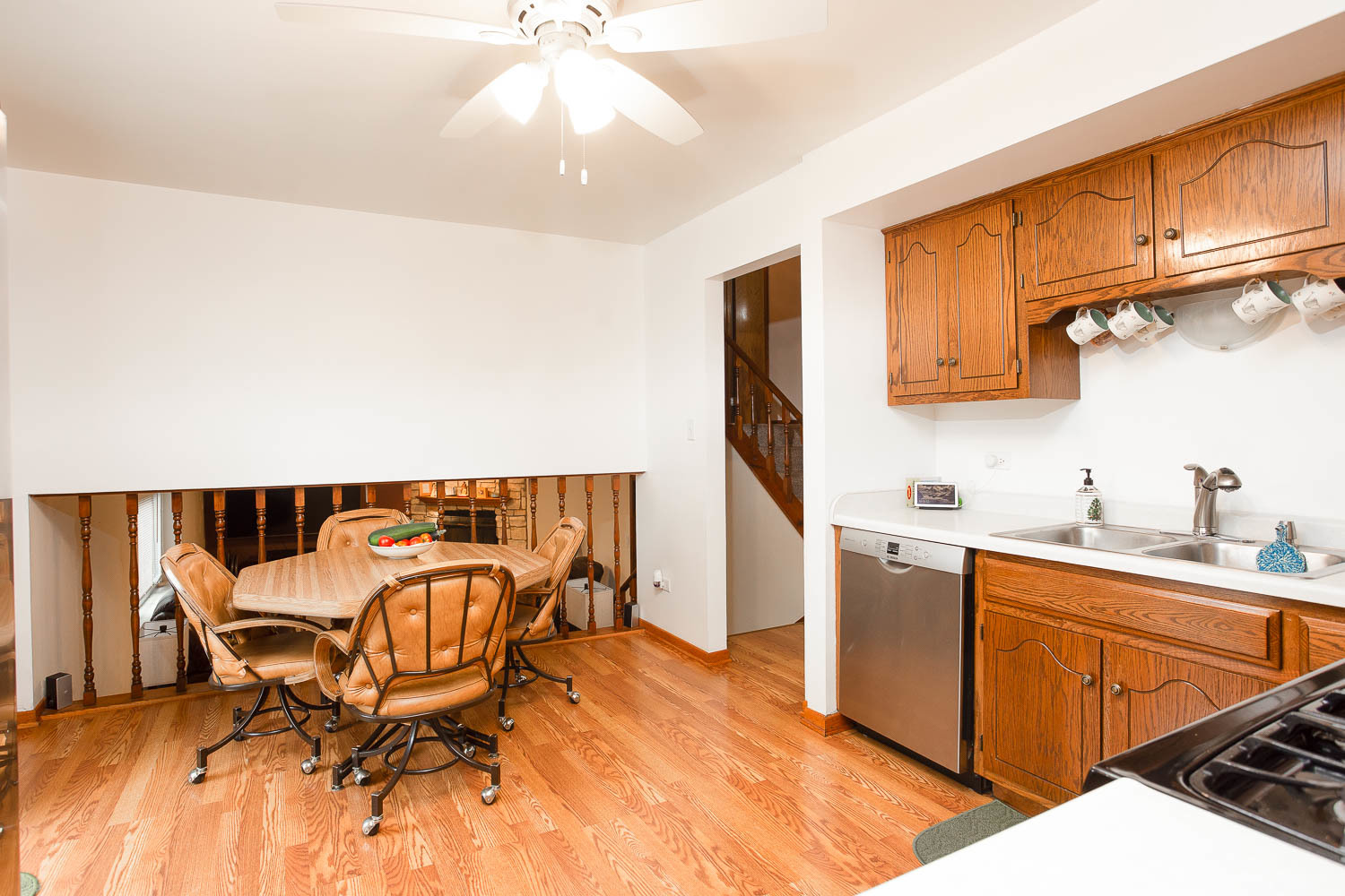 17936 Dekker Avenue Lansing, IL 60438 - Photo 19 of 35 a kitchen with stainless steel appliances kitchen island granite countertop a sink and cabinets