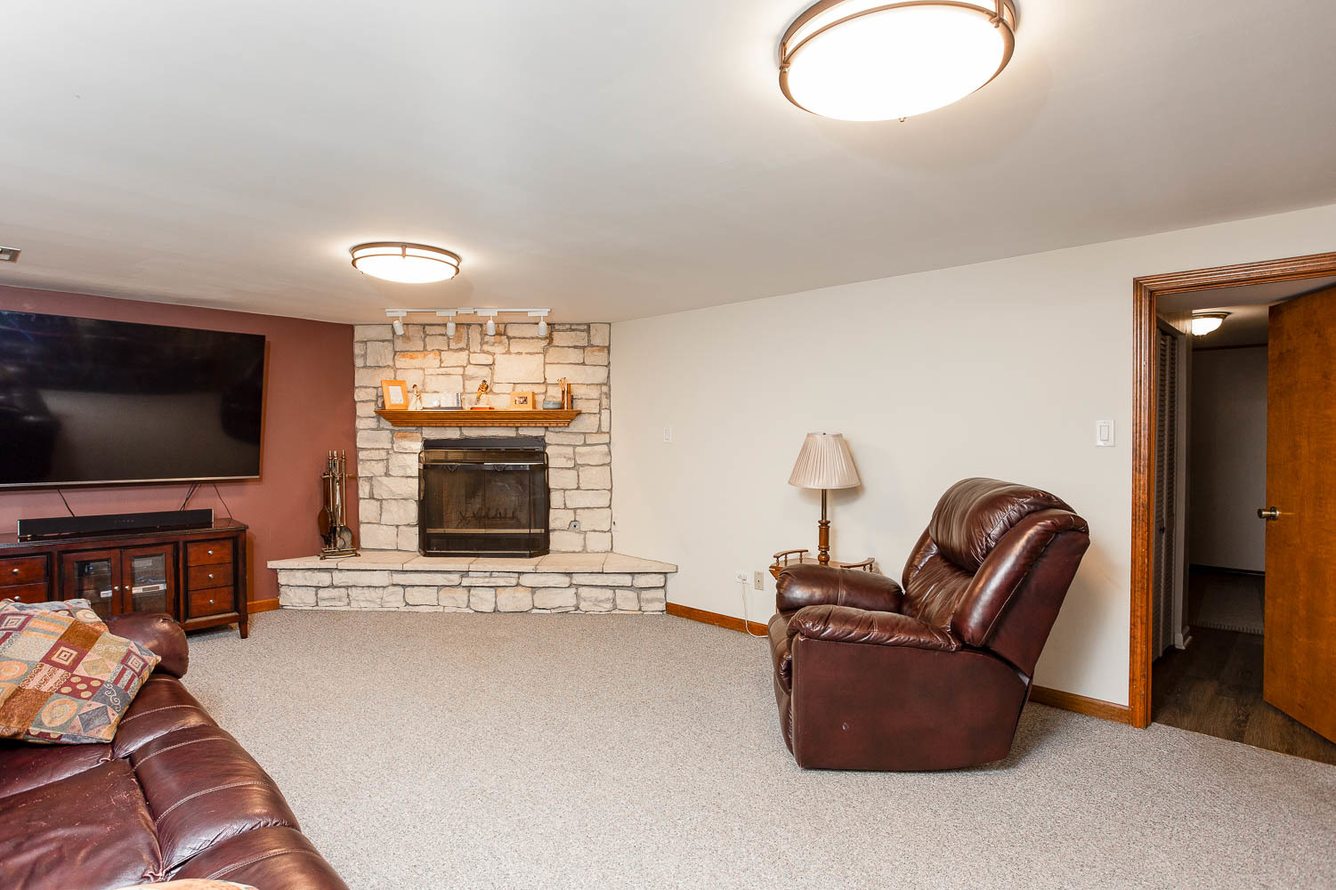 17936 Dekker Avenue Lansing, IL 60438 - Photo 21 of 35 a living room with furniture and a flat screen tv