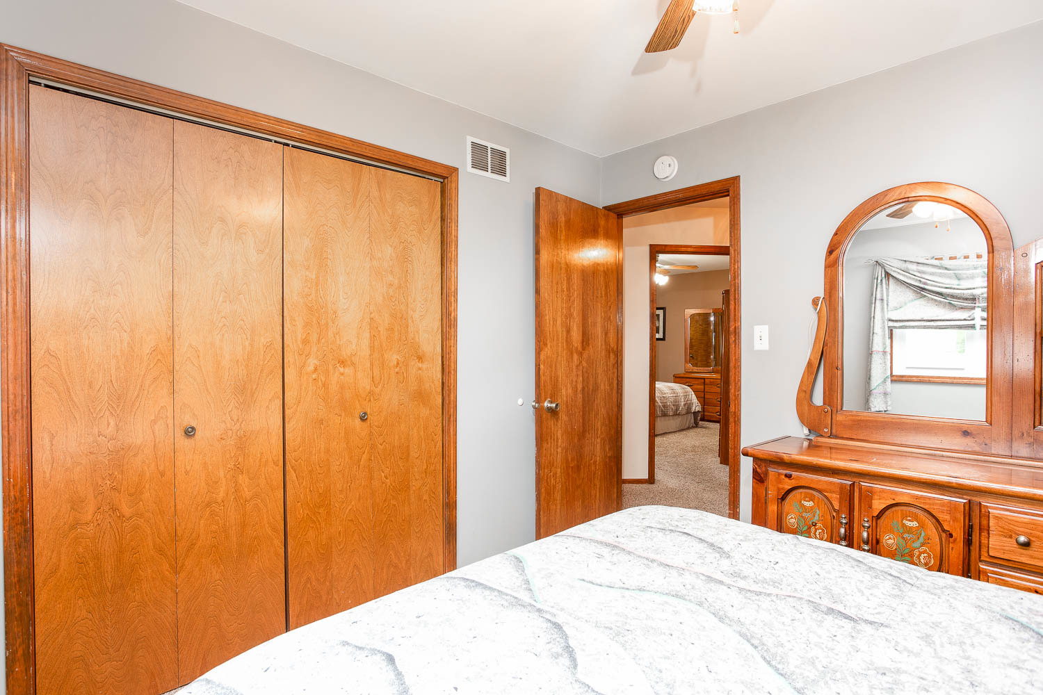 17936 Dekker Avenue Lansing, IL 60438 - Photo 29 of 35 a bedroom with a large bed and a window