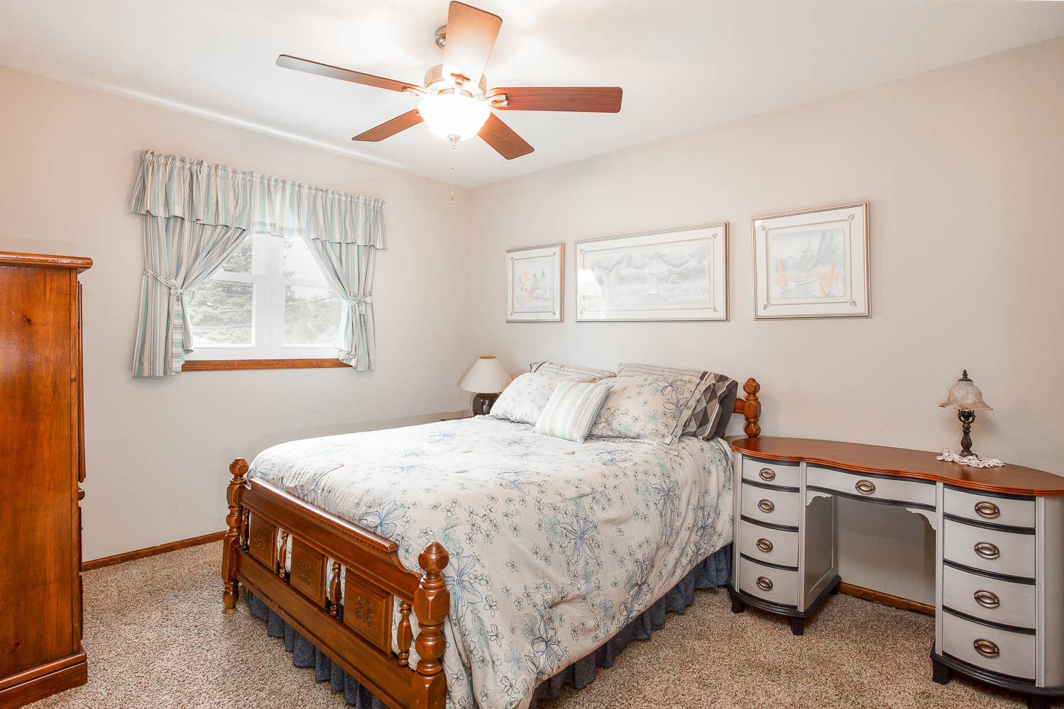 17936 Dekker Avenue Lansing, IL 60438 - Photo 30 of 35 a bed room with a bed and a chandelier