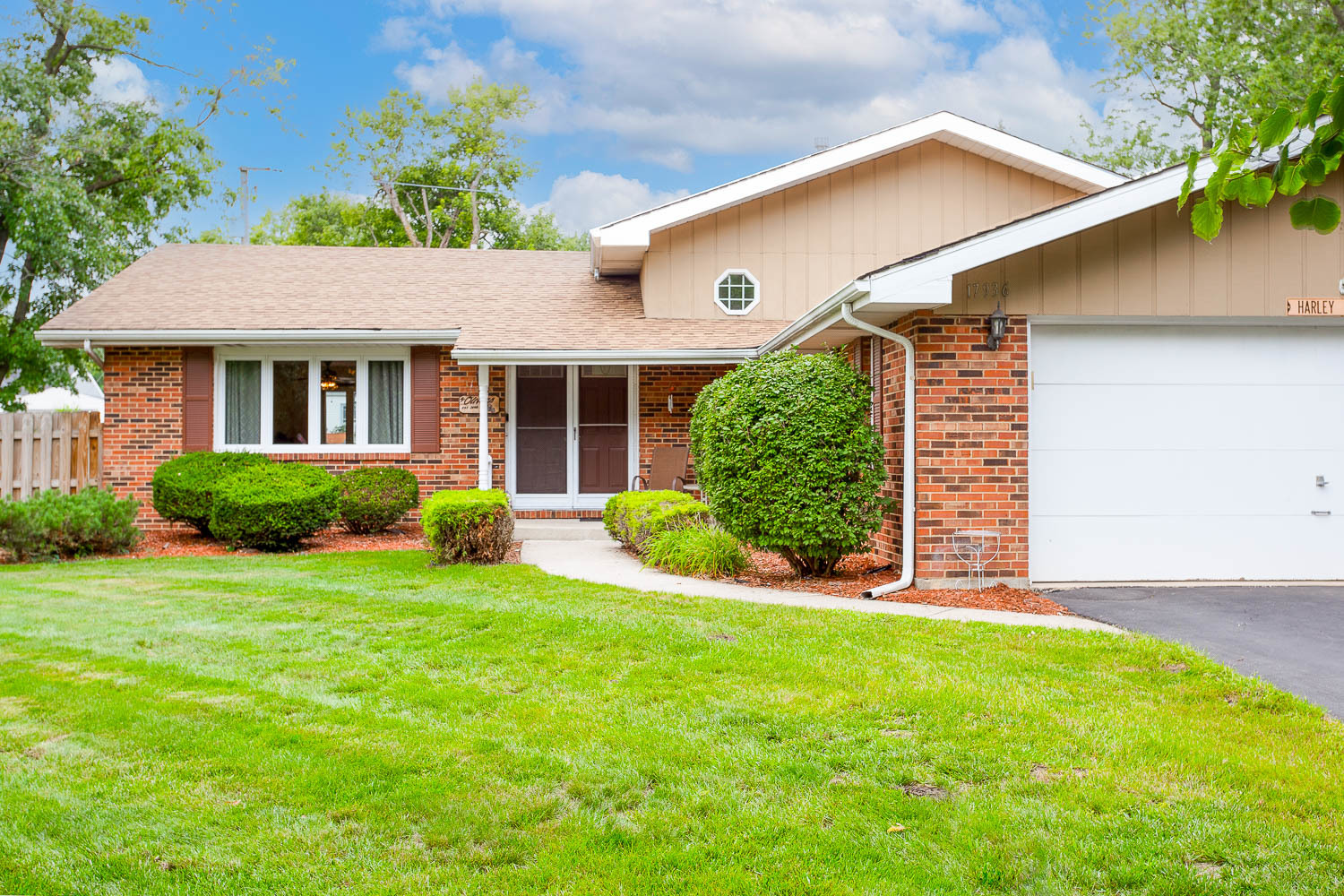 17936 Dekker Avenue Lansing, IL 60438 - Photo 4 of 35 a view of a house with a yard and plants