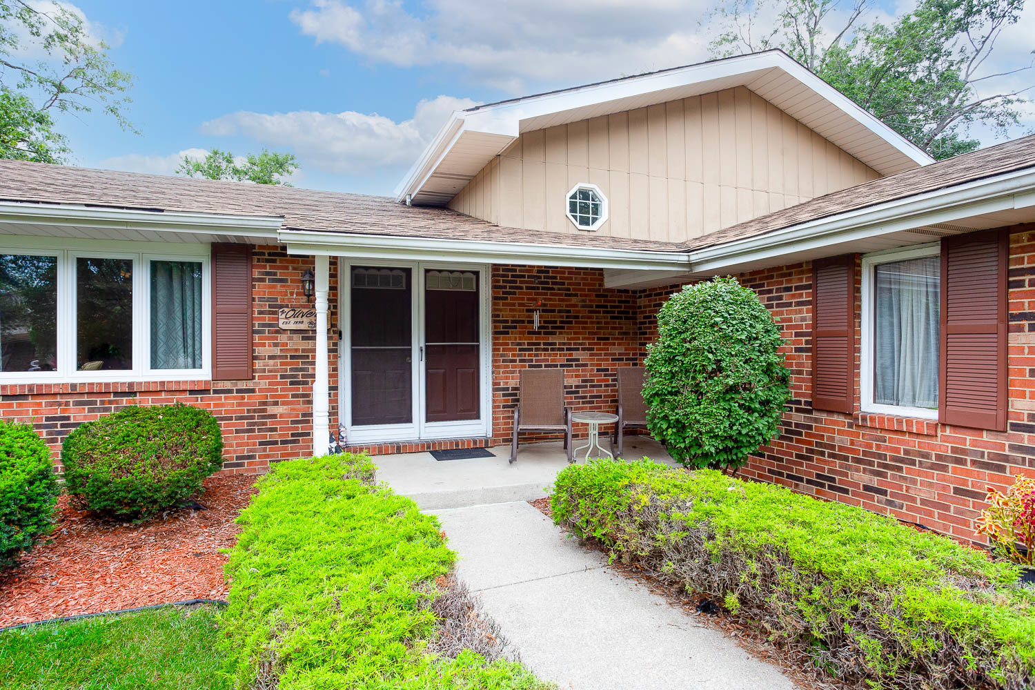 17936 Dekker Avenue Lansing, IL 60438 - Photo 6 of 35 a front view of a house with garden