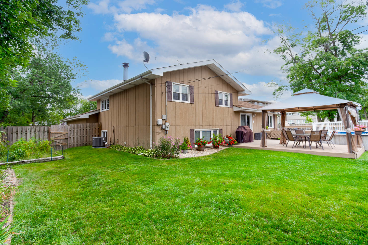 17936 Dekker Avenue Lansing, IL 60438 - Photo 7 of 35 a view of a house with a yard and sitting area