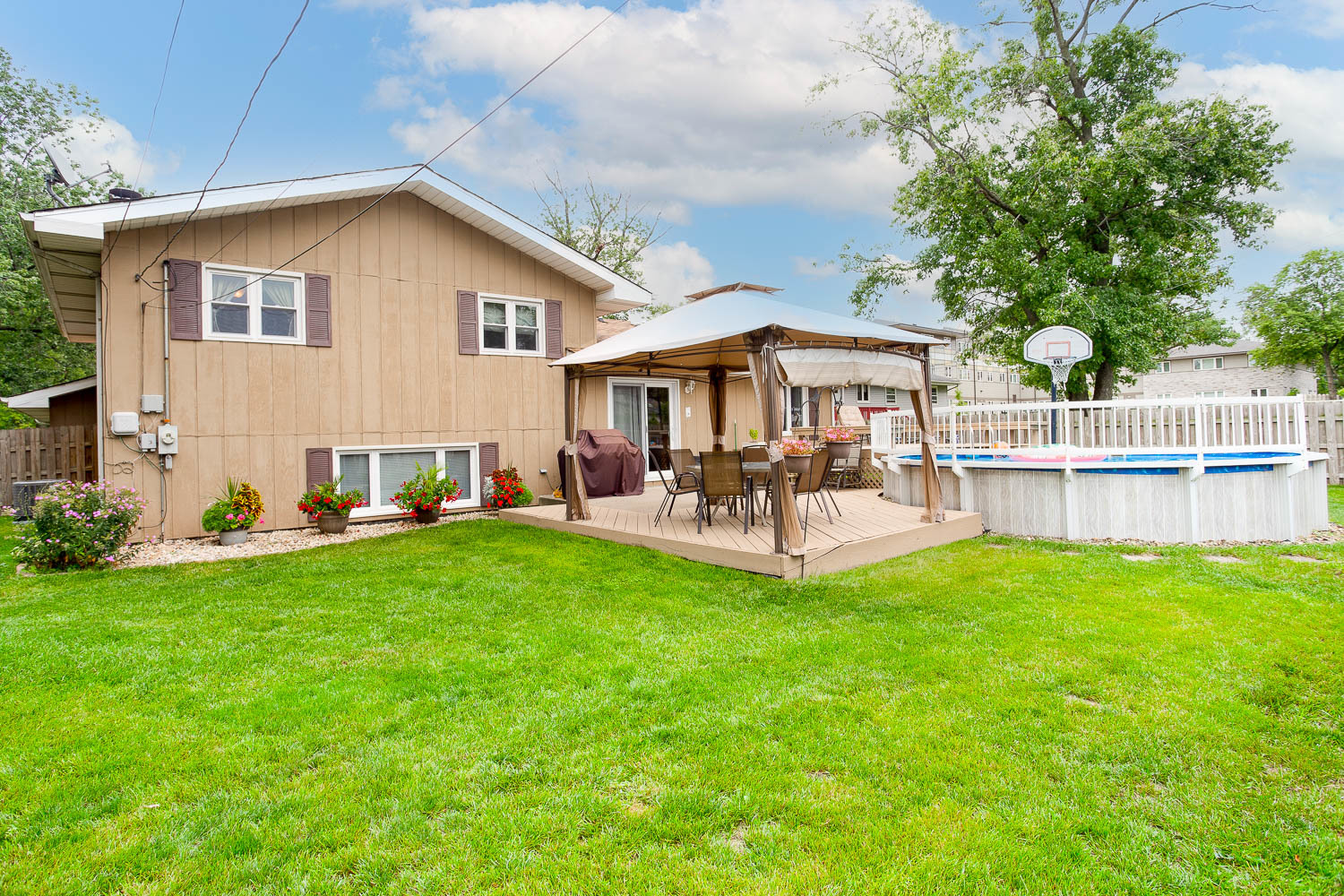 17936 Dekker Avenue Lansing, IL 60438 - Photo 8 of 35 a patio with a table and chairs and a yard