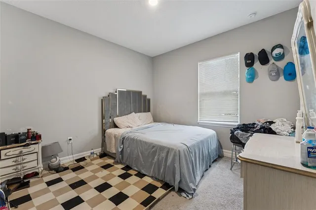 a bedroom with a bed and a dresser