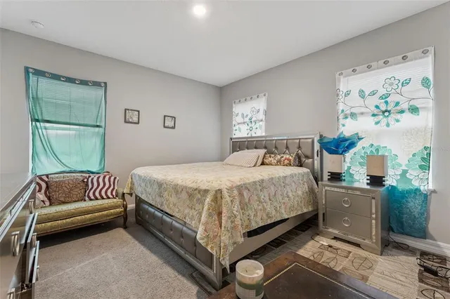 a bedroom with a bed and dresser