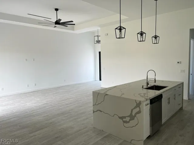a kitchen with a sink and cabinets