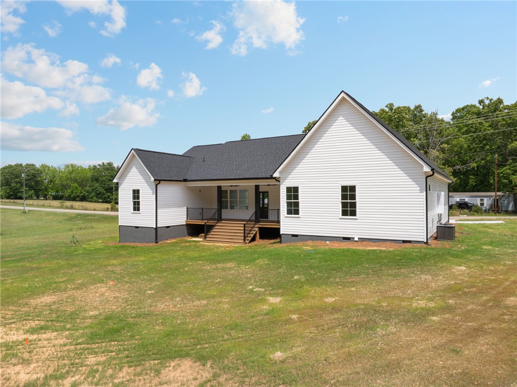 1735 Maw Bridge Road Central, SC 29630 - Photo 32 of 38 This newly constructed home boasts a classic white exterior with a welcoming rear porch.