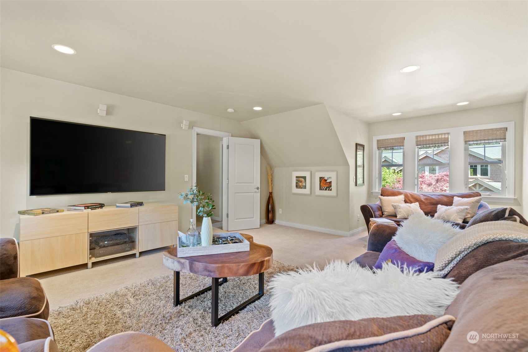 10707 226th Street Southwest Edmonds, WA 98020 - Photo 20 of 39 a living room with furniture and a flat screen tv