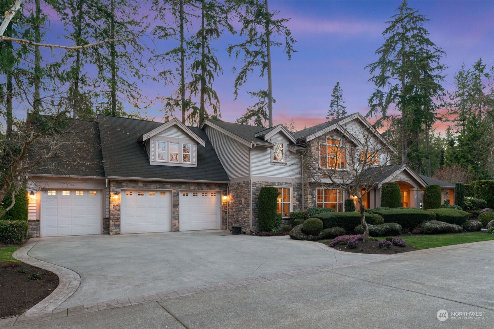 10707 226th Street Southwest Edmonds, WA 98020 - Photo 3 of 39 a front view of a house with garden