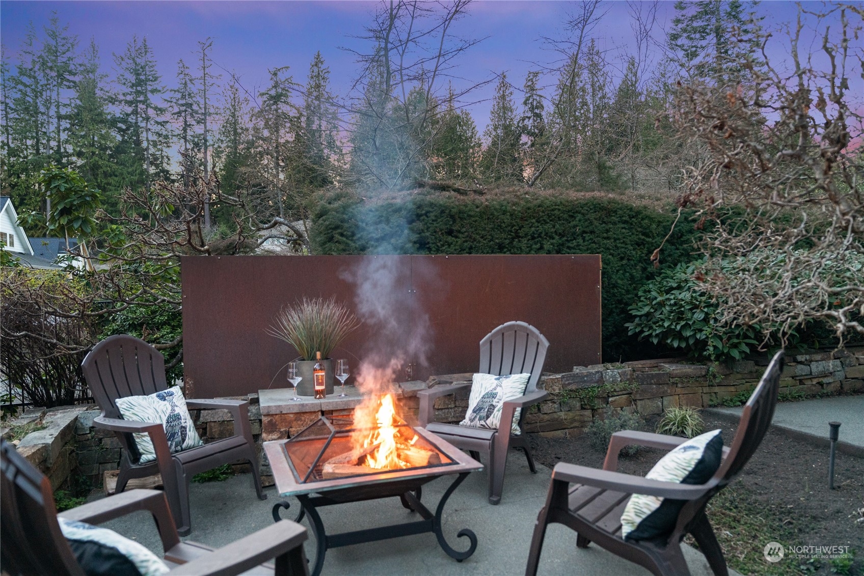 10707 226th Street Southwest Edmonds, WA 98020 - Photo 32 of 39 a backyard of a house with table and chairs