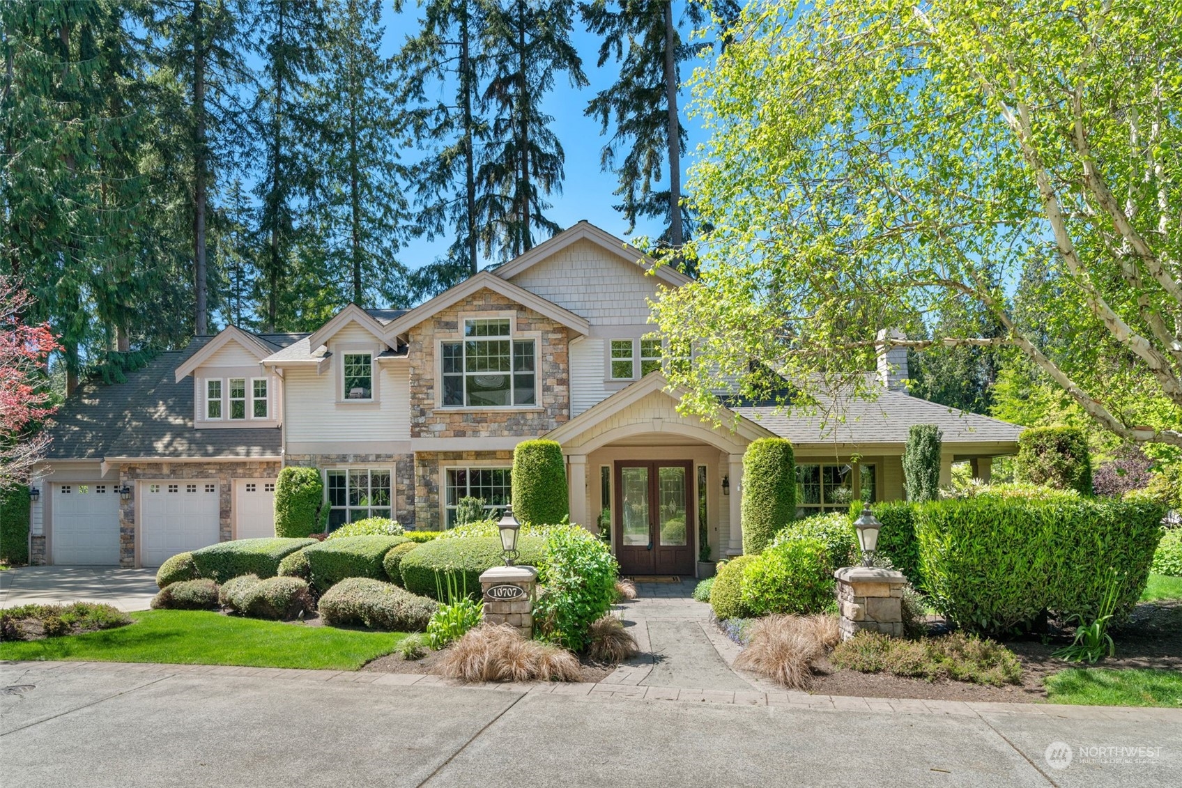 10707 226th Street Southwest Edmonds, WA 98020 - Photo 34 of 39 a front view of a house with a garden and plants