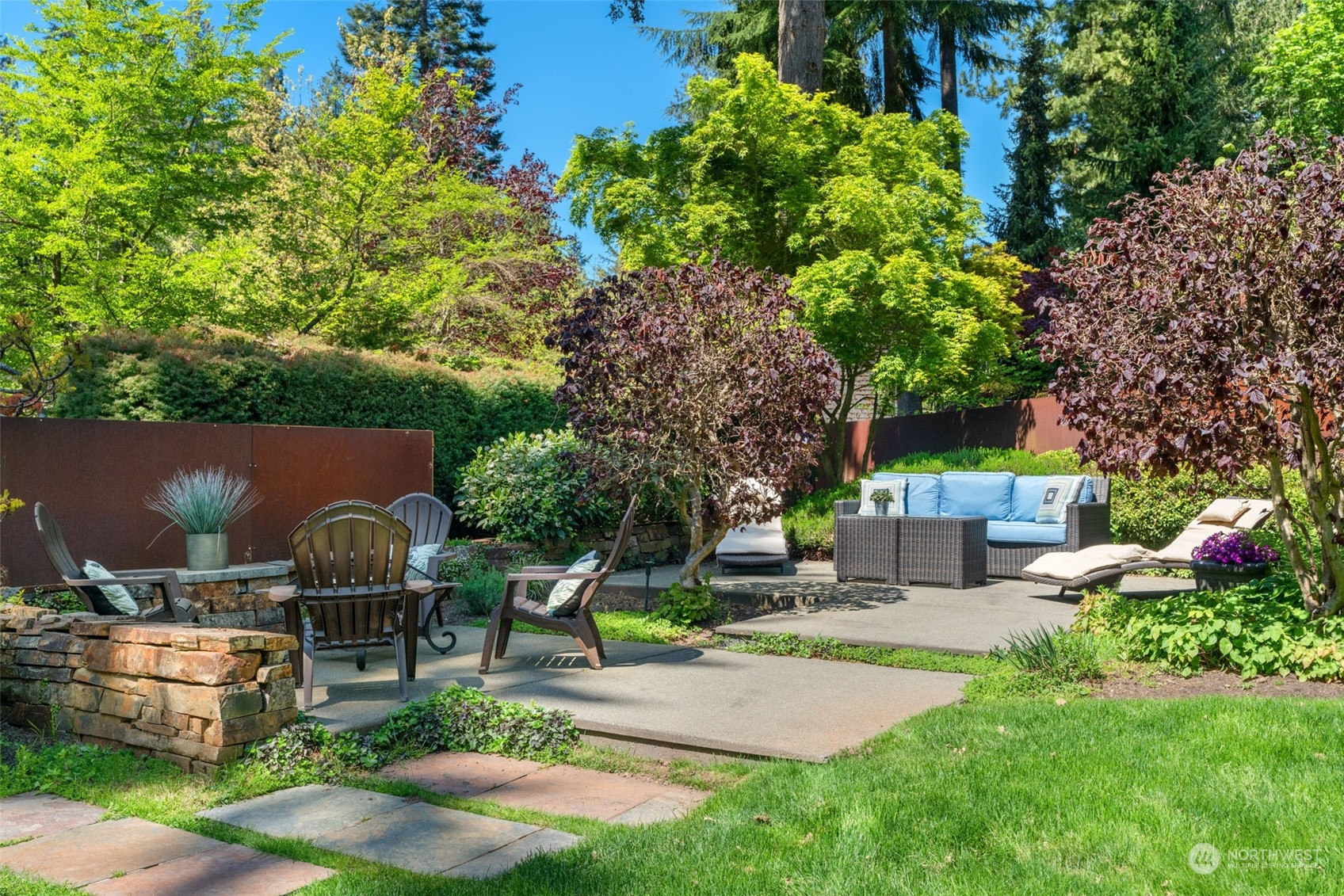 10707 226th Street Southwest Edmonds, WA 98020 - Photo 35 of 39 a roof deck with table and chairs potted plants and a large tree
