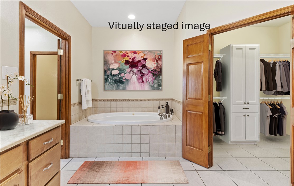 5763 Santa Isabelle Drive Robstown, TX 78380 - Photo 16 of 26 a bathroom with a tub a sink and a shower
