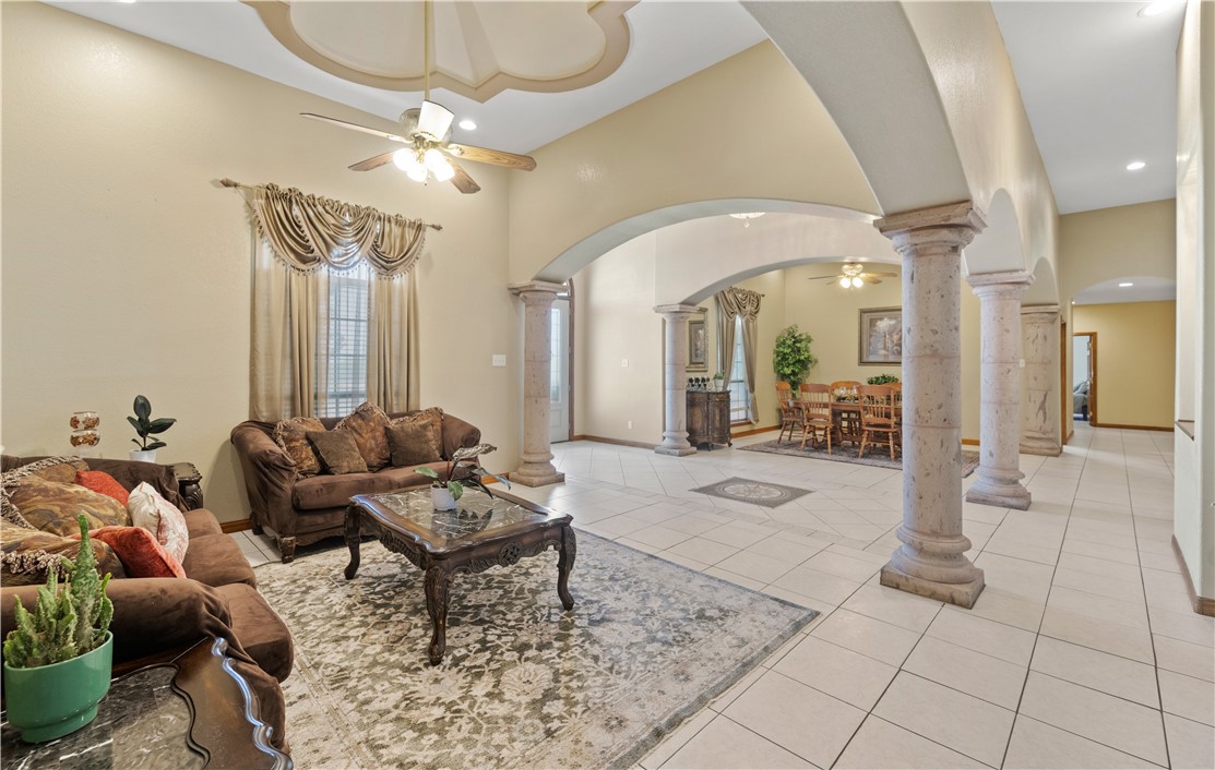 5763 Santa Isabelle Drive Robstown, TX 78380 - Photo 6 of 26 a living room with furniture and a chandelier
