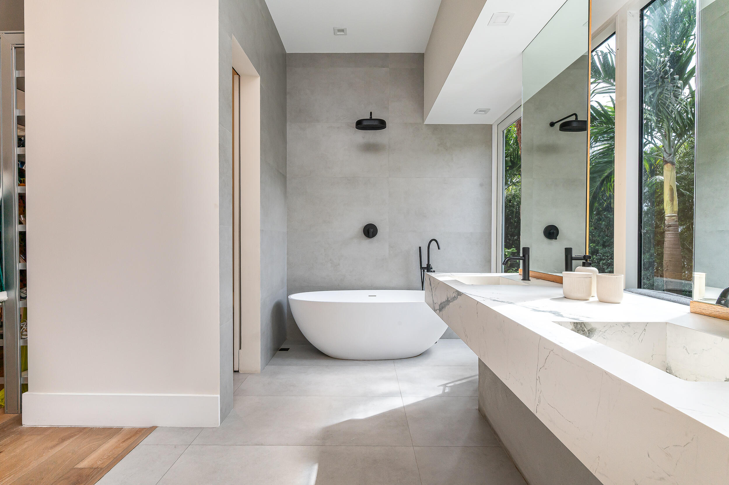 4740 Bay Point Road Miami, FL 33137 - Photo 11 of 27 a bathroom with a tub sink and mirror