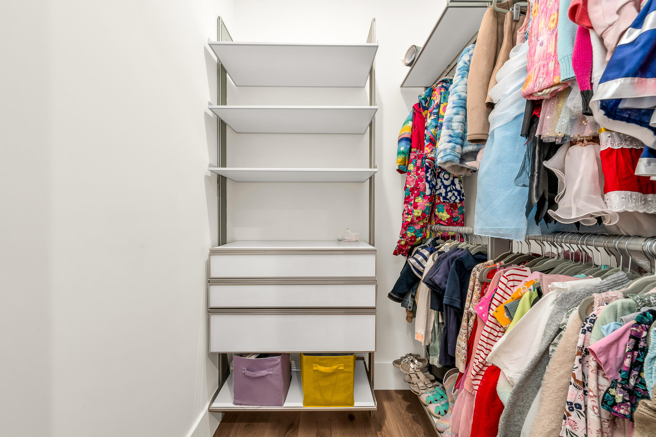 4740 Bay Point Road Miami, FL 33137 - Photo 15 of 27 a view of walk in closet with clothes and shoes