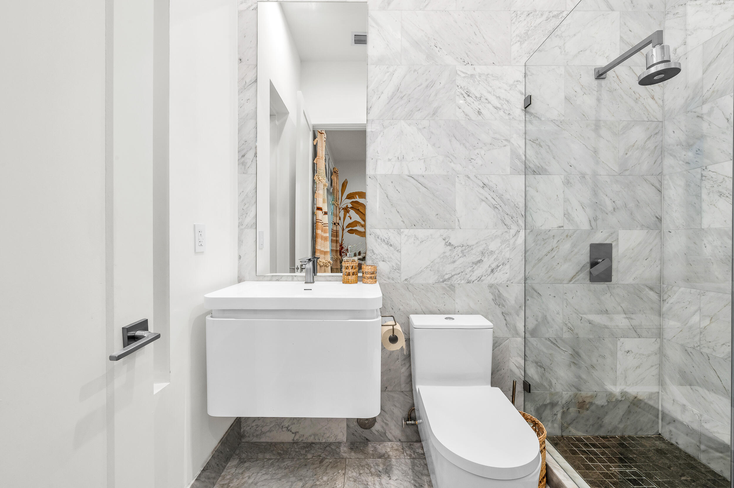 4740 Bay Point Road Miami, FL 33137 - Photo 16 of 27 a white toilet sitting next to a bathroom sink