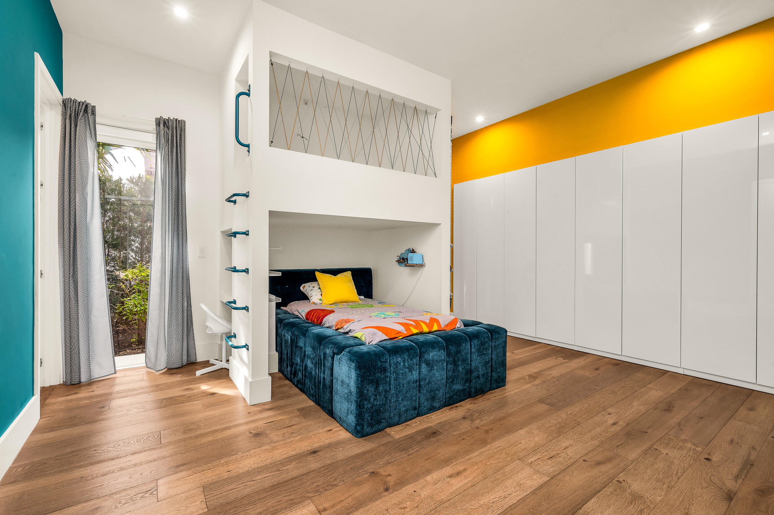 4740 Bay Point Road Miami, FL 33137 - Photo 17 of 27 a bedroom with a bed and wooden floor