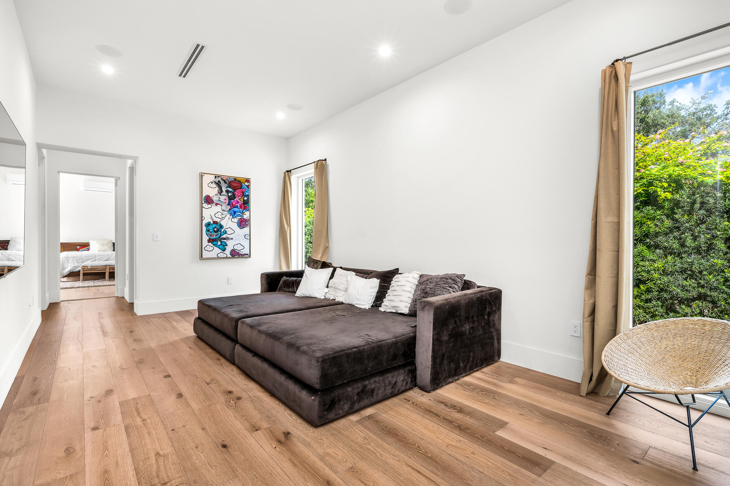 4740 Bay Point Road Miami, FL 33137 - Photo 18 of 27 a bedroom with a bed and a table in it