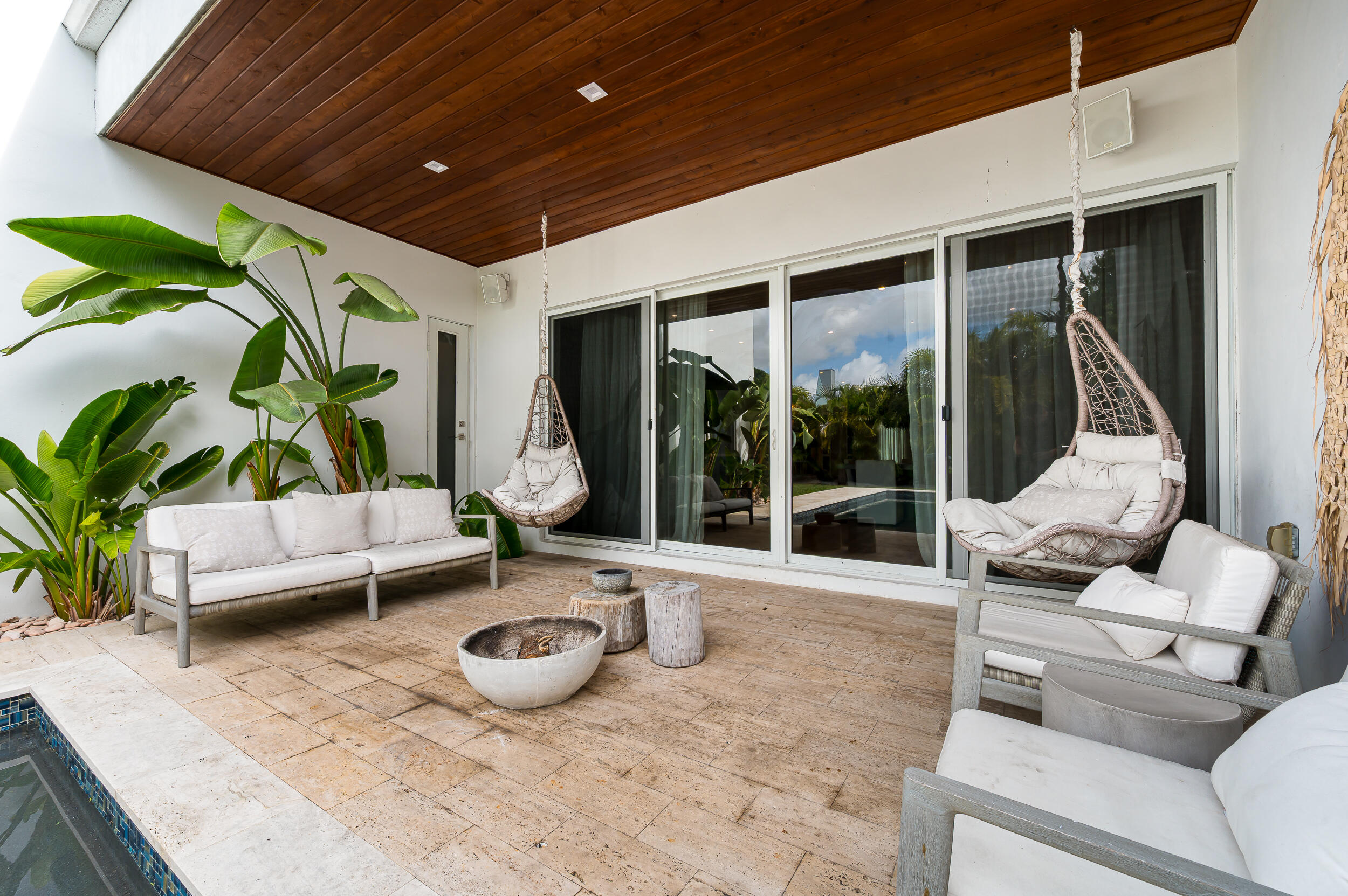 4740 Bay Point Road Miami, FL 33137 - Photo 26 of 27 a building outdoor space with patio furniture and potted plants
