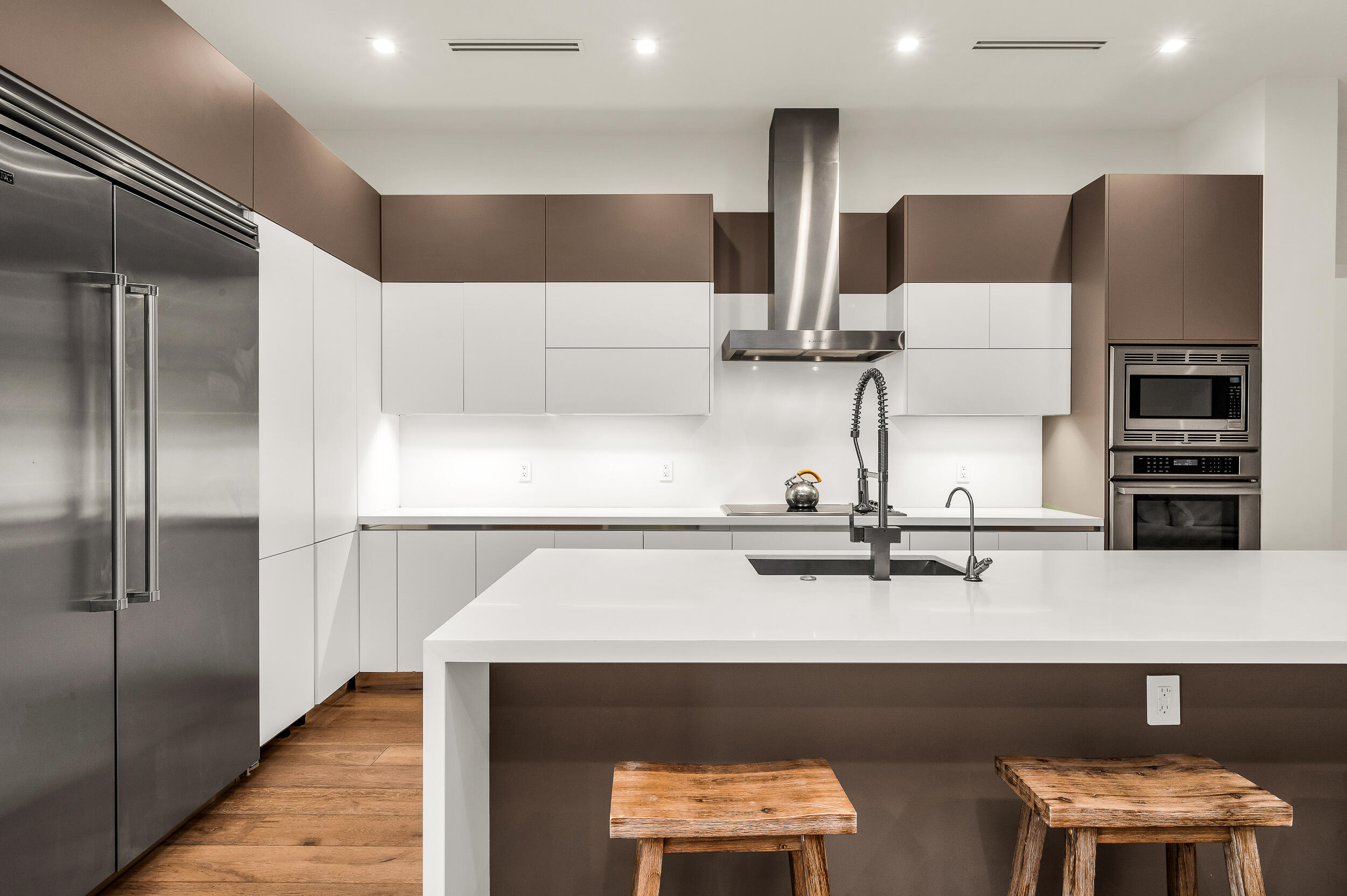 4740 Bay Point Road Miami, FL 33137 - Photo 7 of 27 a kitchen with stainless steel appliances a refrigerator and a sink