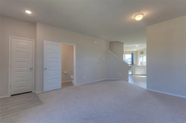 an empty room with closet area
