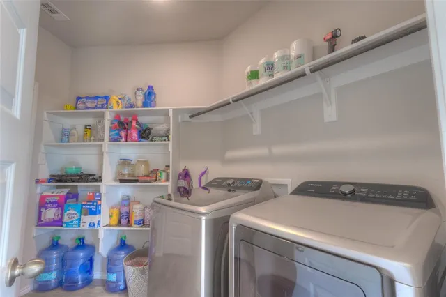 a utility room with dryer and washer