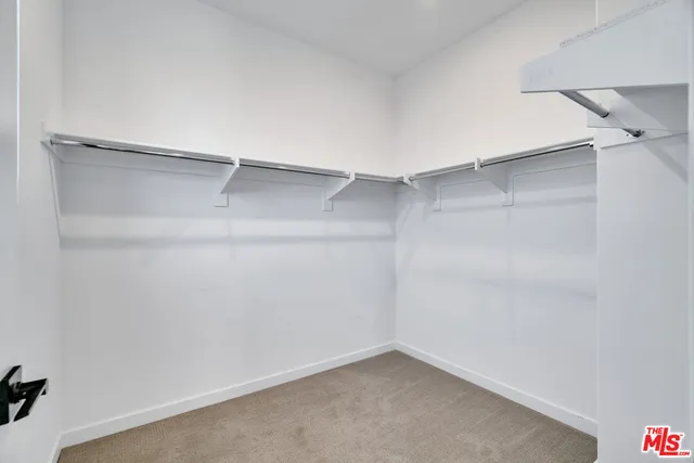 a view of an empty walk in closet