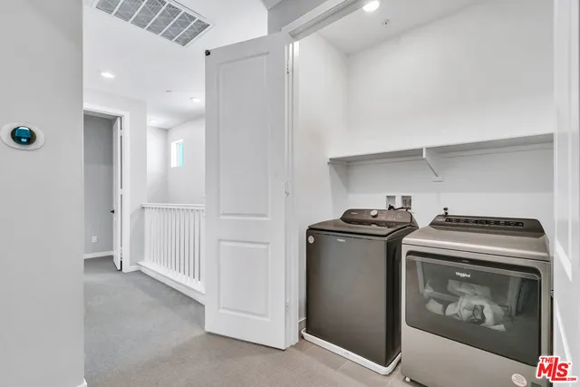 a kitchen with a stove and a refrigerator