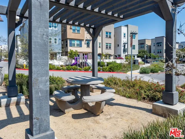 a picture of a bench in front of a wall