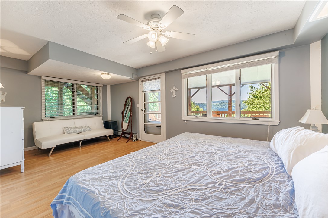 198 East Lake Road Middlesex, NY 14544 - Photo 26 of 50 SPACIOUS BEDROOM WITH ACCESS TO LOWER LEVEL DECK