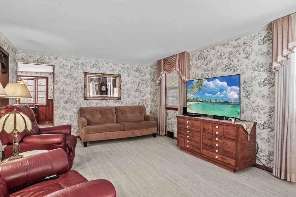 64 Timothy Circle Springfield, MA 01119 - Photo 14 of 34 a living room with furniture and a flat screen tv