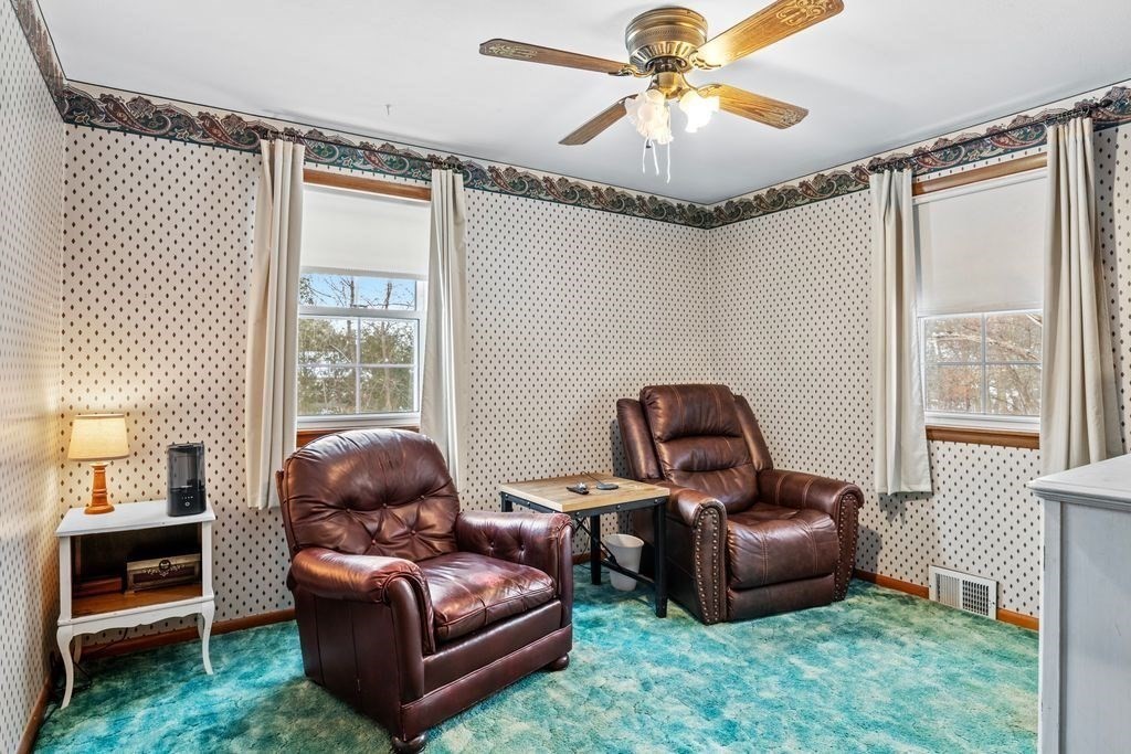 64 Timothy Circle Springfield, MA 01119 - Photo 17 of 34 a living room with furniture and a chandelier