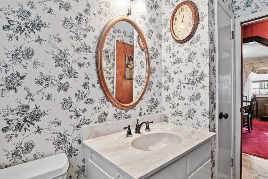 64 Timothy Circle Springfield, MA 01119 - Photo 20 of 34 a bathroom with a sink and a mirror