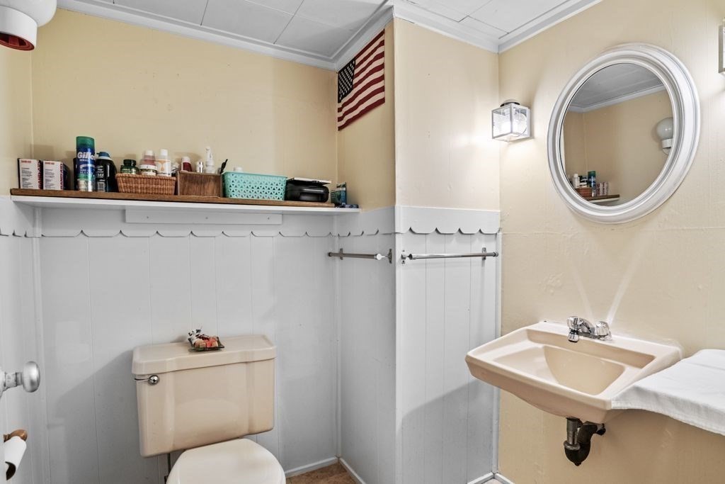64 Timothy Circle Springfield, MA 01119 - Photo 29 of 34 a bathroom with a sink a toilet and a mirror