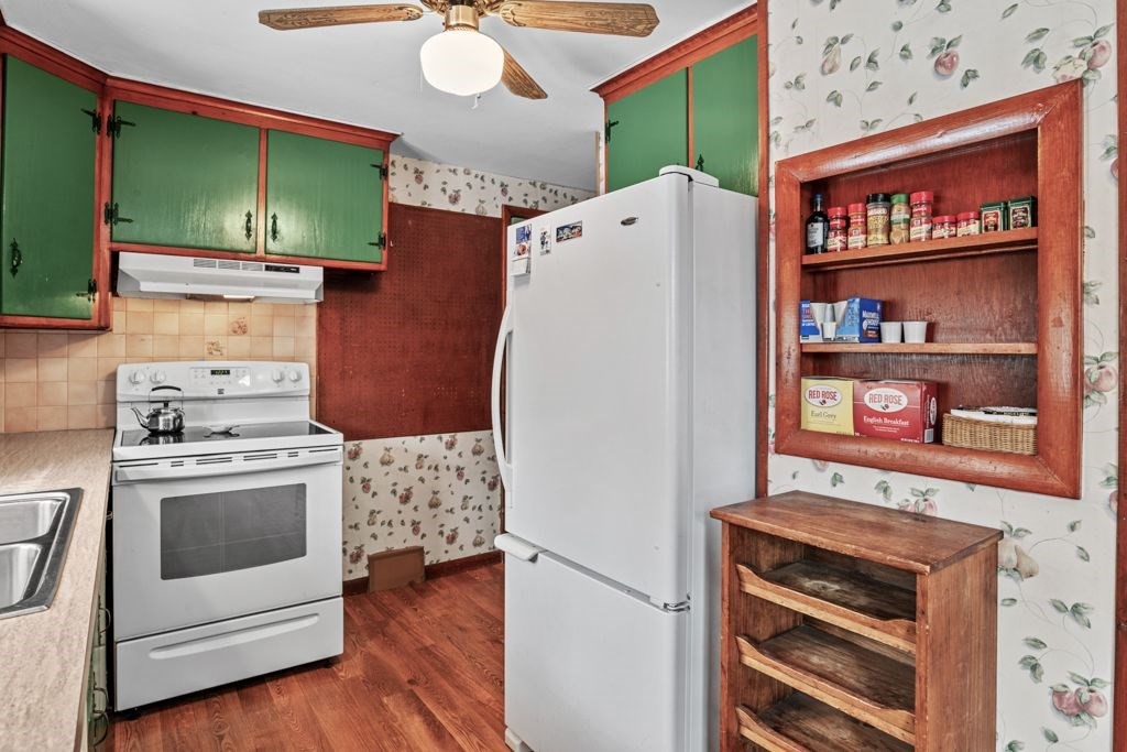 64 Timothy Circle Springfield, MA 01119 - Photo 5 of 34 a kitchen with stainless steel appliances a stove and a refrigerator