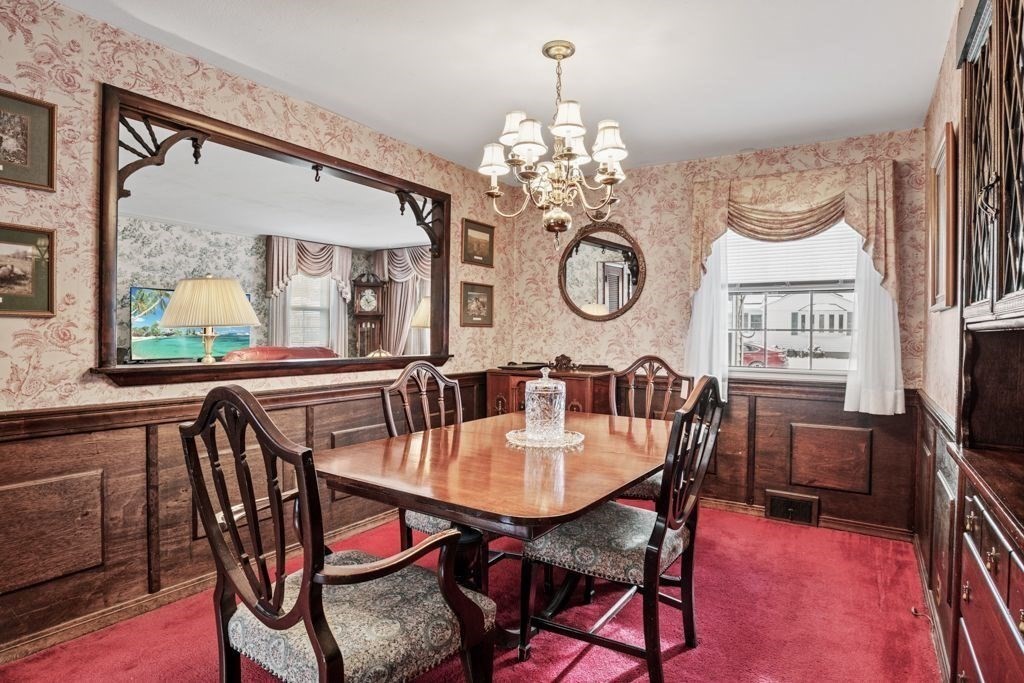 64 Timothy Circle Springfield, MA 01119 - Photo 10 of 34 a dining room with furniture a chandelier and wooden floor