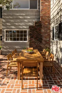a front view of a building with a door and wooden floor
