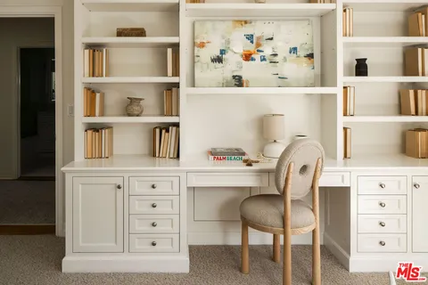 a view of a chair and table in a kitchen