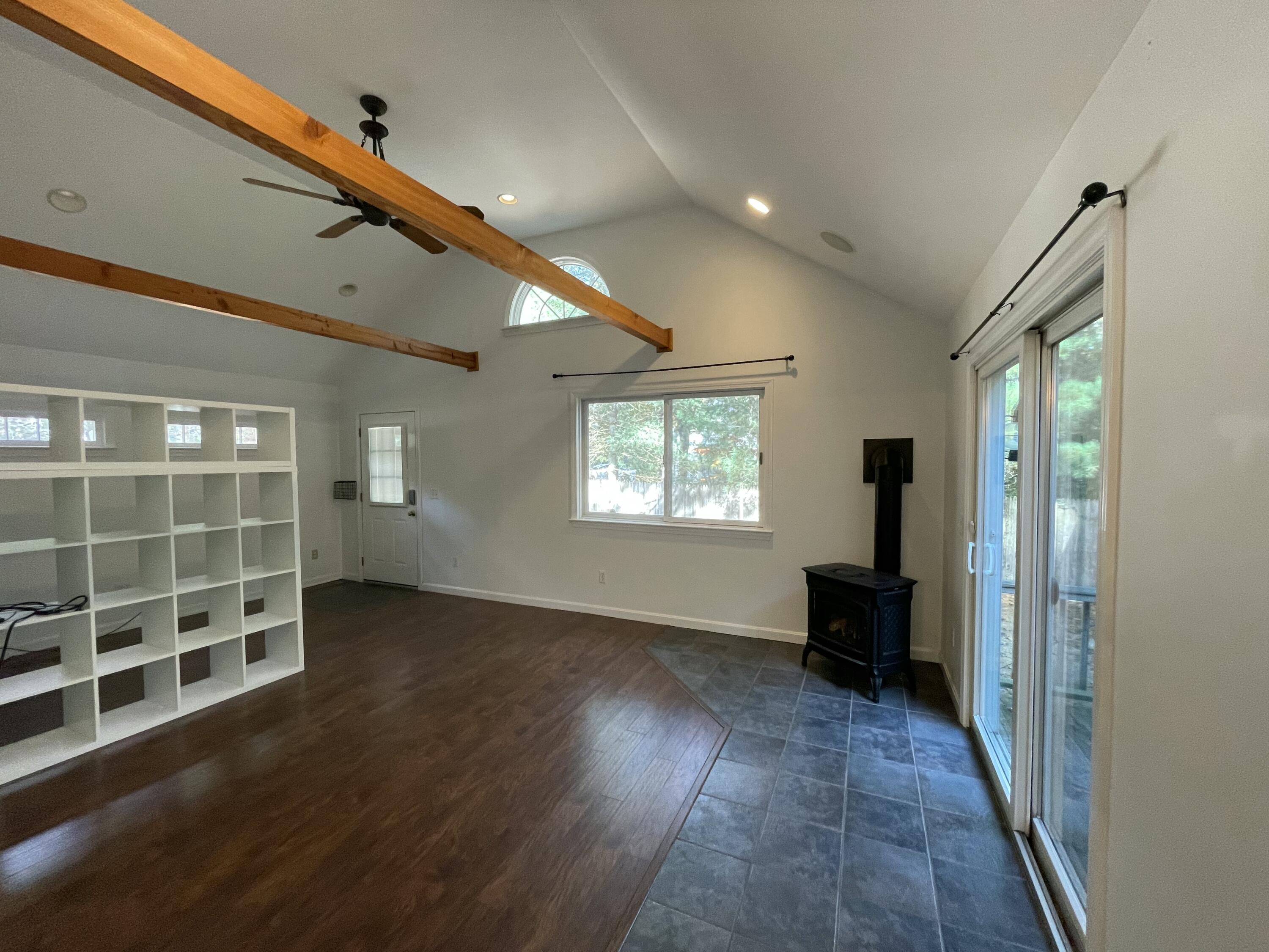 18 Sandy Valley Road Marstons Mills, MA 02648 - Photo 13 of 18 an empty room with wooden floor and windows