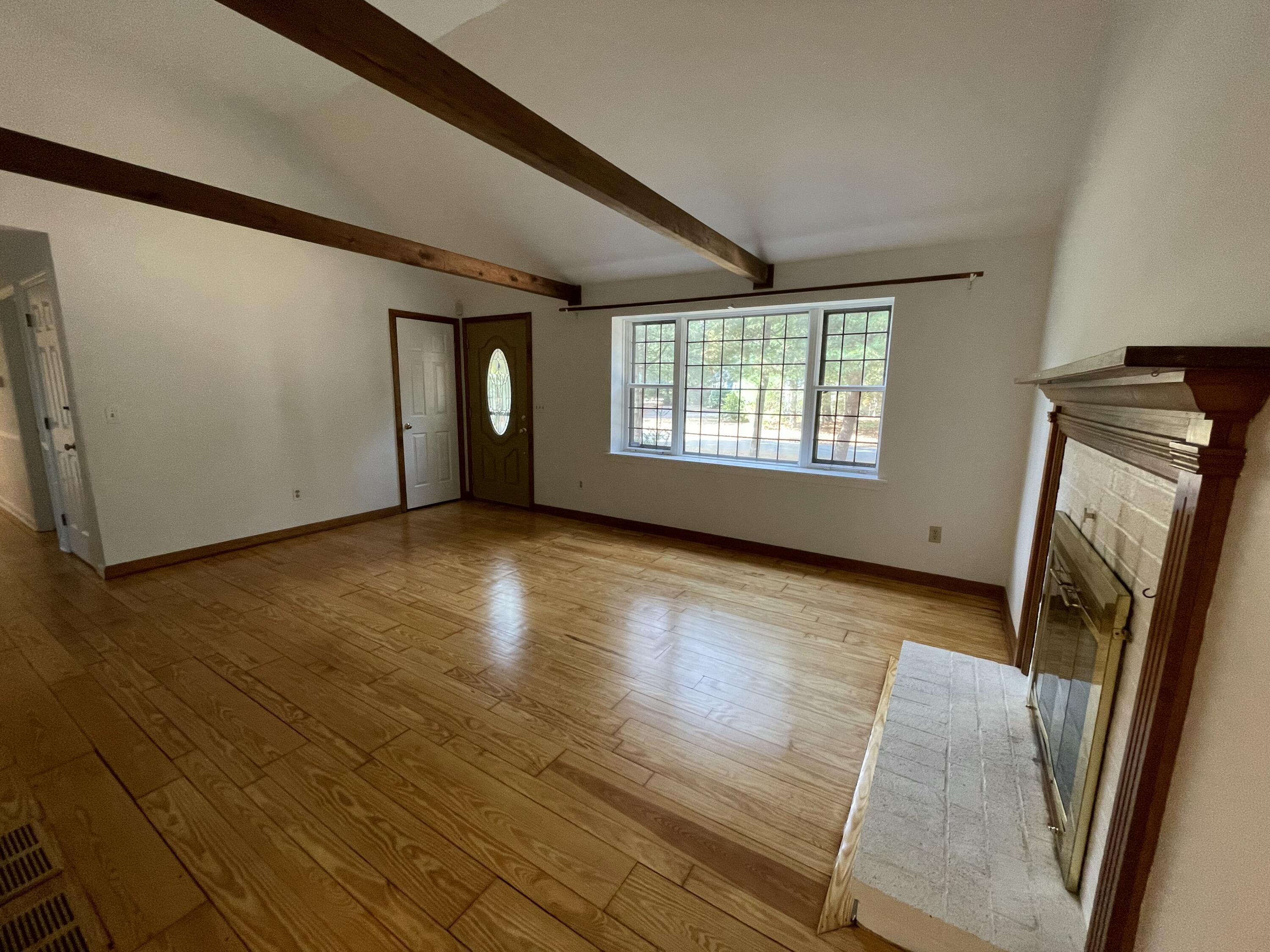 18 Sandy Valley Road Marstons Mills, MA 02648 - Photo 3 of 18 a view of an empty room with wooden floor and a window
