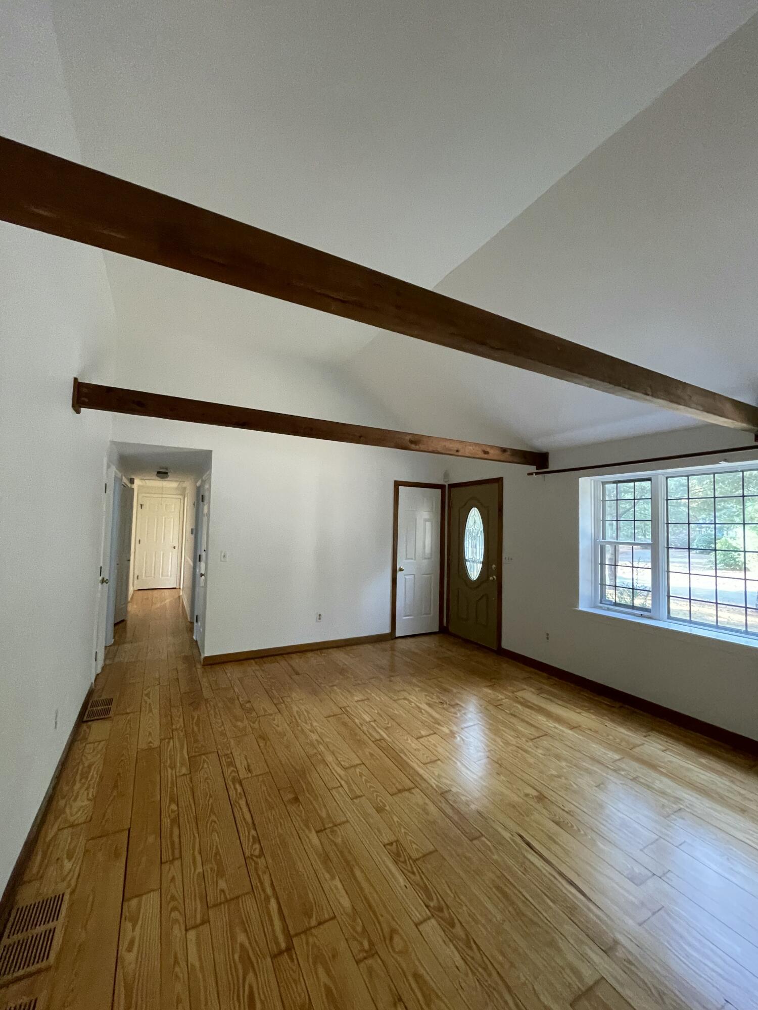 18 Sandy Valley Road Marstons Mills, MA 02648 - Photo 4 of 18 a view of an empty room with wooden floor and a window