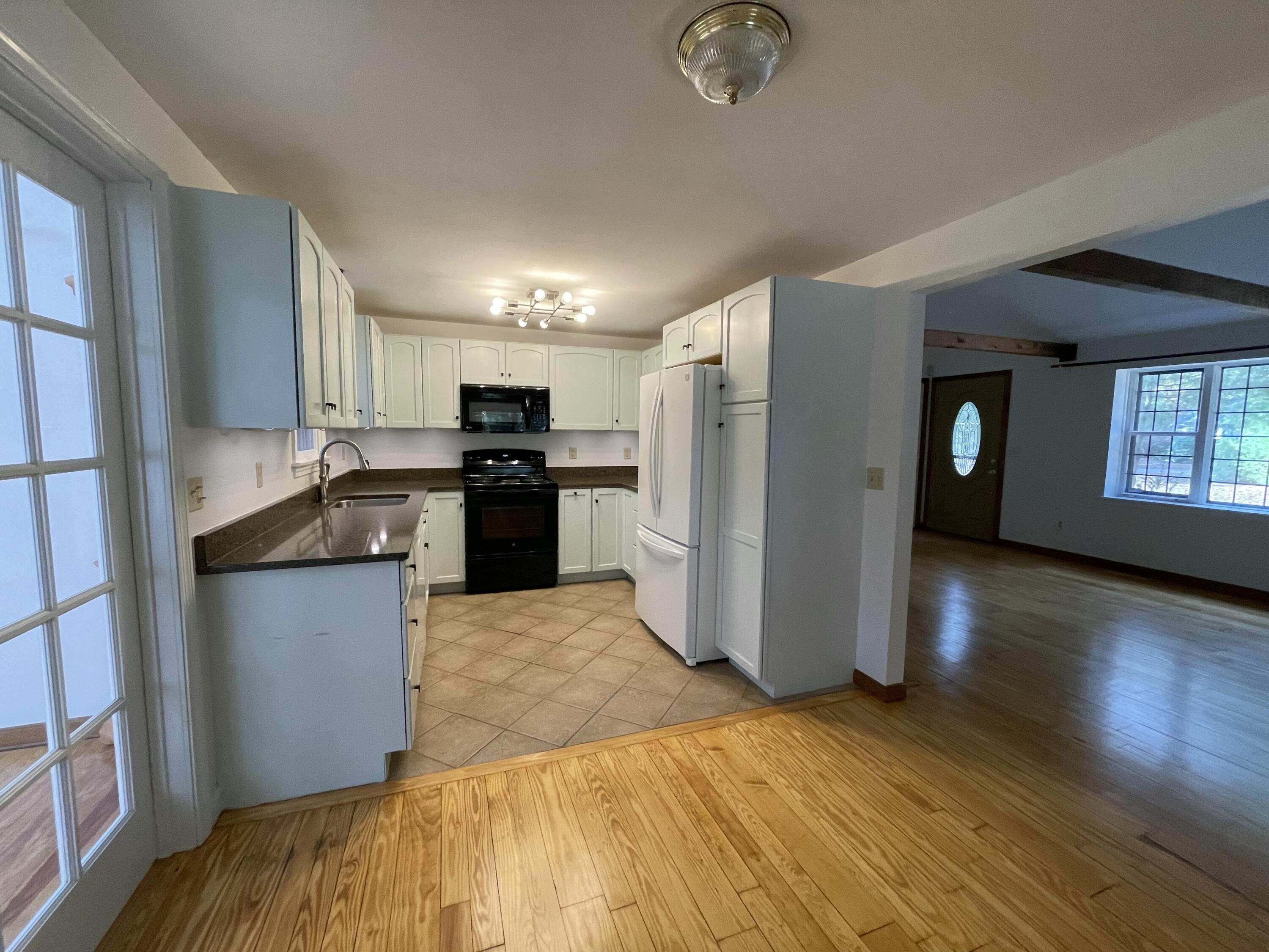 18 Sandy Valley Road Marstons Mills, MA 02648 - Photo 7 of 18 a kitchen with stainless steel appliances granite countertop a refrigerator a stove top oven a sink and dishwasher