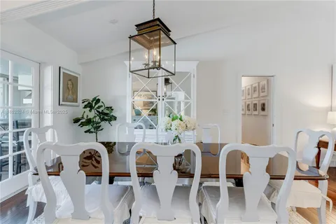 a dining room with furniture and chandelier