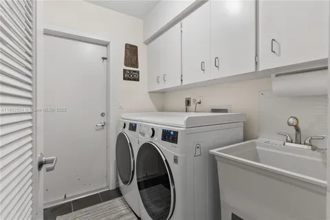 a spacious bedroom with a bed and a large window